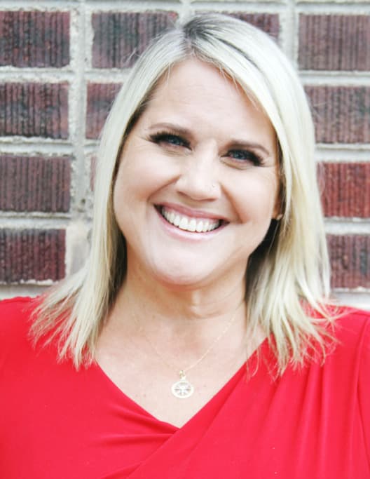 Team member portrait wearing a red t-shirt